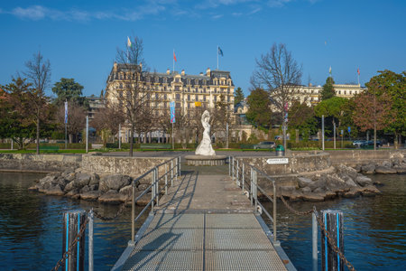 Lausanne, Switzerland - Dec 04, 2019: Place du Vieux-Port Fountain and Beau-Rivage Palace Hotel at Ouchy Promenade - Lausanne, Switzerlandのeditorial素材