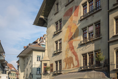 Bern, Switzerland - Nov 25, 2019: Old Town Bern with Building Mural by Ernst Linck - Standard Bearer and Bear - Bern, Switzerlandのeditorial素材