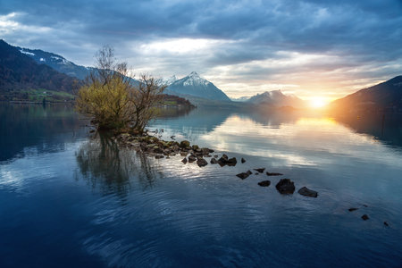 Lake Thun at Sunset with Niesen Mountain view of Alps from Unterseen - Interlaken, Switzerlandの写真素材