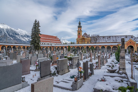 Innsbruck, Austria - Nov 14, 2019: Wilten Cemetery and Wilten Monastery Church - Innsbruck, Austriaのeditorial素材