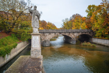 Munich, Germany - Nov 03, 2019: John of Nepomuk Statue and Pratever Bridge (Praterwehrbrucke) - Munich, Bavaria, Germanyのeditorial素材