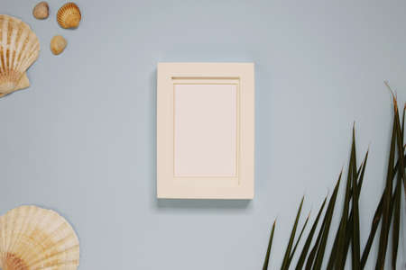 White frame creative summer layout mockup, light blue background with shell and summer nature