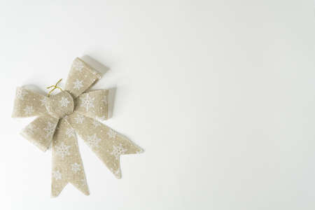 Christmas ribbon in gold color and white backgroundの写真素材