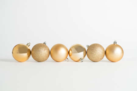Christmas decorations, golden spheres on white backgroundの写真素材