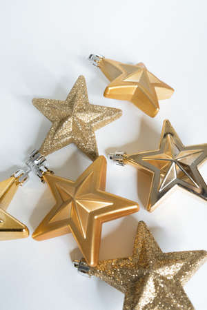 Christmas decorations, golden stars on white backgroundの写真素材