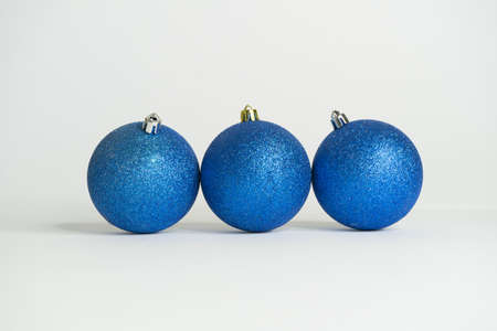 Blue christmas balls with white backgroundの写真素材