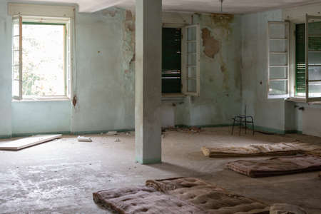 Old bed in abandoned kid colony room in Italyの写真素材