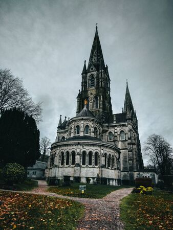 Gothic Cathedral surrounded by trees in a cold winter dayの写真素材