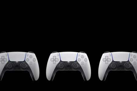 3 Playstation 5 Dual Sense controllers on black background. Top view. Rio de Janeiro, RJ, Brazil. June 2021のeditorial素材
