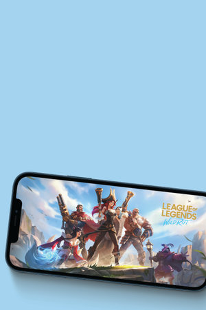 League of Legends game app on the smartphone screen on blue background. Top view. Rio de Janeiro, RJ, Brazil. June 2021.のeditorial素材