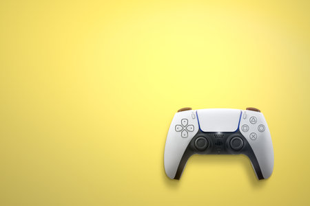 Playstation 5 Dual Sense controller isolated on yellow background. Top view and space for text . Rio de Janeiro, RJ, Brazil. June 2021.のeditorial素材