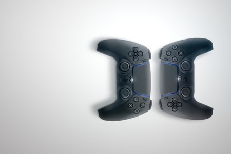 2 Playstation 5 Dual Sense black controllers isolated on white background. Top view. Rio de Janeiro,...