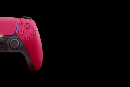 Playstation 5 Dual Sense Cosmic Red controller isolated on black background. Top view. Rio de...