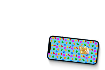 Candy Crush Saga game app on smartphone screen on white background. Rio de Janeiro, RJ, Brazil....