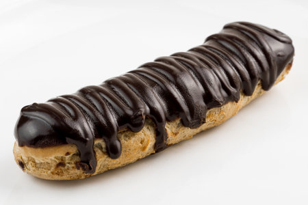 Chocolate Bomb Dessert. Brazilian traditional Ã©clair on a white background. Macro close-up.