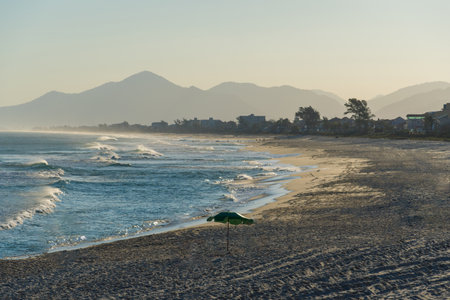 Sunset at Saquarema beach in Rio de Janeiro, Brazil. Famous for waves and surfing. Church on top of the hill.の写真素材