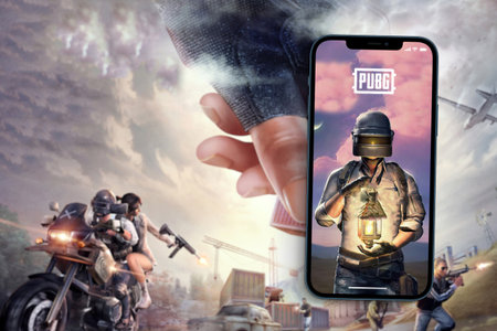 Player's Unknown Battleground also known as PUBG online shooting gaming mobile game app on smartphone screen with the game blurred on background. Rio de Janeiro, RJ, Brazil. August 2021.のeditorial素材