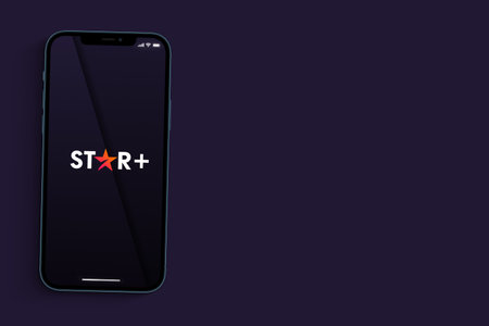Star Plus, Disney app on the smartphone screen on purple background. Rio de Janeiro, RJ, Brazil. September 2021.のeditorial素材