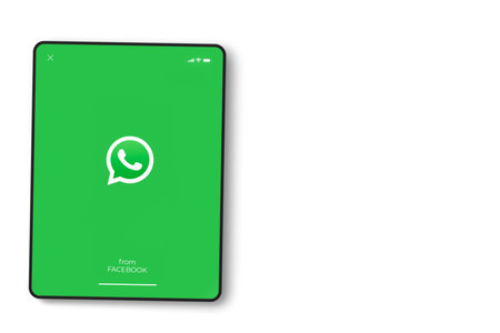 WhatsApp app on the iPad screen on white background. Top view. Rio de Janeiro, RJ, Brazil. September 2021.のeditorial素材