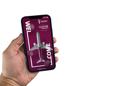 Male hand holding a smartphone with Qatar Airways on the screen. White background. Rio de Janeiro, RJ, Brazil. September 2021.のeditorial素材
