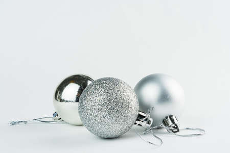 Christmas ornament isolated on white background. Polka dots to hang on Christmas trees to celebrate the arrival of Santa Claus. Silver ball.の写真素材