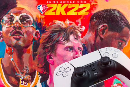 Playstation 5 Dual Sense Controller with NBA 2k22 Basketball game blurred in the background. Rio de...