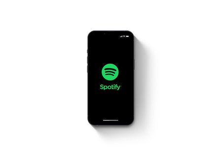 Spotify app on smartphone iPhone 13 Pro screen on white background. Rio de Janeiro, RJ, Brazil....