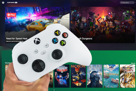 Male hand holding Xbox Series S Robot White Controller with Cloud Gaming Pass game blurred in the...