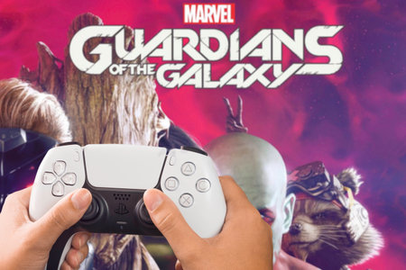Female hand holding a Playstation 5 White Controller with Marvel Guardians of the Galaxy game...