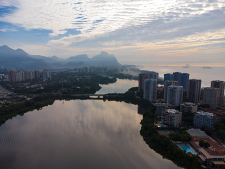 Aerial view of Marapendi Lagoon. In the background, Barra da Tijuca beach and hills like Pedra da GÃ¡vea, in Rio de Janeiro, Brazil. Dawn. Sunny day with some clouds. Drone photo.の写真素材