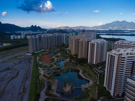 Aerial view of Ilha Pura Park at sunset. In the background, the hills of Rio de Janeiro, Brazil and...