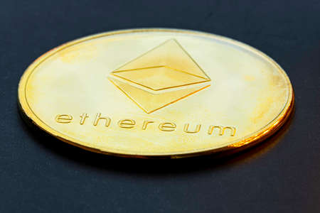 Closeup of a golden Bitcoin coin with white background. Cryptocurrency coin. Financial market....