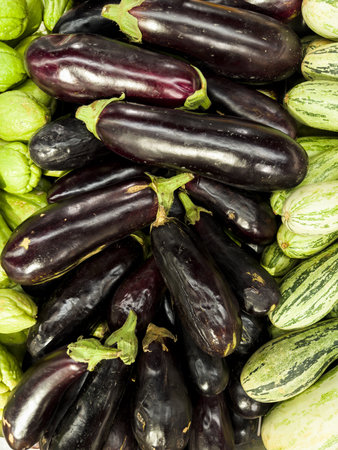 Fresh eggplant in the supermarket. Vegetables and fruits exposed for the consumer to choose. Top view.の写真素材