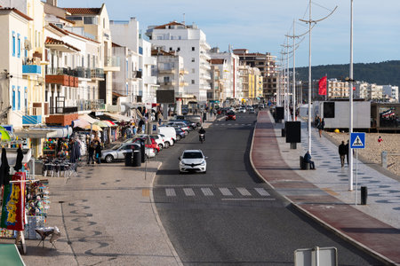 View of the city and the beach 'Praia da NazarÃ©' at sunset in NazarÃ©, Portugal.の写真素材