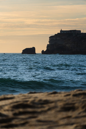 View of the city and the beach 'Praia da NazarÃ©' at sunset in NazarÃ©, Portugal. NazarÃ©...