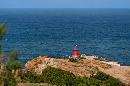 Fort of Sao Miguel Arcanjo Lighthouse in Nazare. View from the hill to the beach 'Praia da NazarÃ©', Praia do Norte and city of NazarÃ©, Portugal.の写真素材