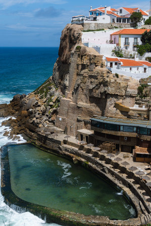 Azenhas do Mar is a seaside town in the municipality of Sintra, Portugal. Close to Lisbon. Azenhas do Mar white village, cliff and ocean. Sunny dayの写真素材