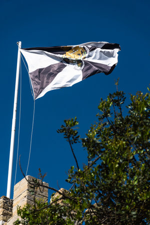 Flag of Portugal and Lisbon at SÃ£o Jorge Castle. Exterior wall facade of historic ruin Saint George Castle.の写真素材
