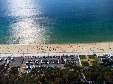 Aerial view of Playa de Samil, the main beach of Vigo in Galicia in northwest Spain. Sunny day, crystal clear blue sea. Houses, streets. Drone.の写真素材