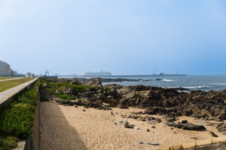 LeÃ§a da Palmeira Beach, Porto, Portugal, near Matosinhos. Sunny day. Cruise ship in the...