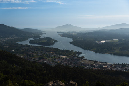 view of Vila Nova de Cerveira, Portugal. Miradouro do Cervo Viewpoint. Alto Minho, Viana do Castelo in Portugal. On one side of the river is Portugal, on the other is Spain.の写真素材