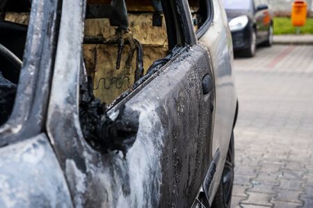 Closeup of the car burnt down on the city car parkの写真素材