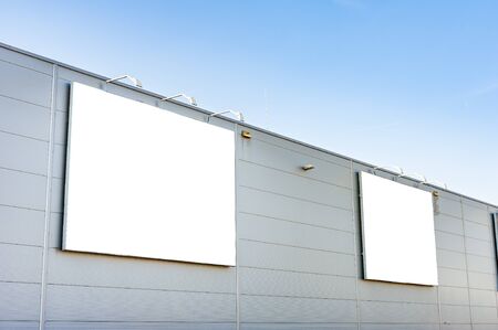 Advertising billboards mockups on the wall of warehouse/factory buildingの写真素材