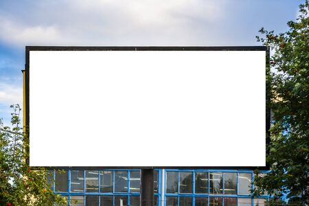Blank advertising billboard mockup in front of industrial buildingの写真素材
