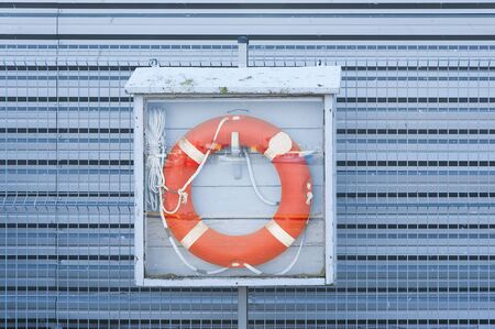 Orange lifebuoy on the boat