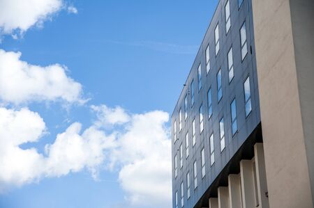 Closeup of the modern office building on a sunny dayの写真素材