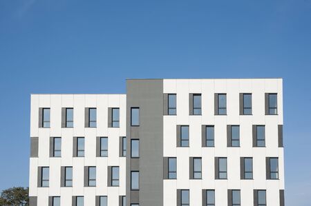 White and grey facade of modern office building
