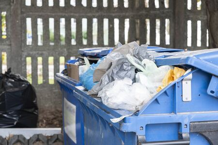 Closeup of overloaded garbage containersの写真素材