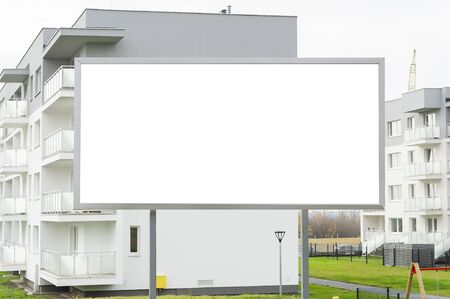 Blank billboard for advertisement in the front of modern residential buildingの写真素材