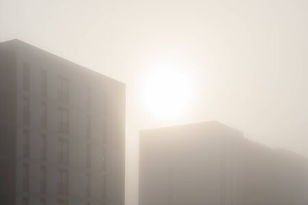 Modern apartment buildings in a foggy morningの写真素材